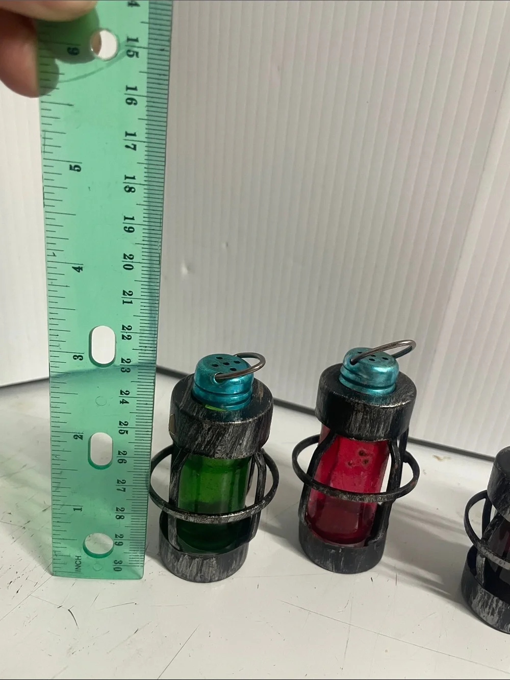 2 sets of salt and pepper shakers look like lanterns